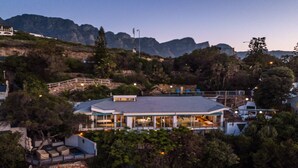 A modern hotel with a flat roof, large windows, and a balcony area. - Breathtaking Clifton 4th beach villa (Clifton)