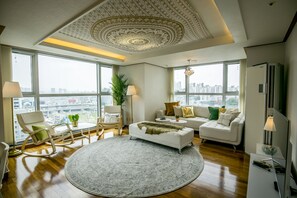 Luxury Apartment - Foreigner Only (Superior Cozy Home) | Living room | 50-inch flat-screen TV with cable channels, TV - SJ Tailored Serviced APT 3min Walk From Seoul STN (Seoul)