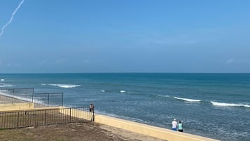 On the beach, sun loungers, beach towels