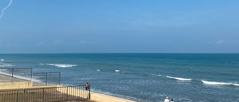 On the beach, sun-loungers, beach towels