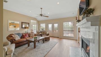 Smart TV, fireplace, books, video library