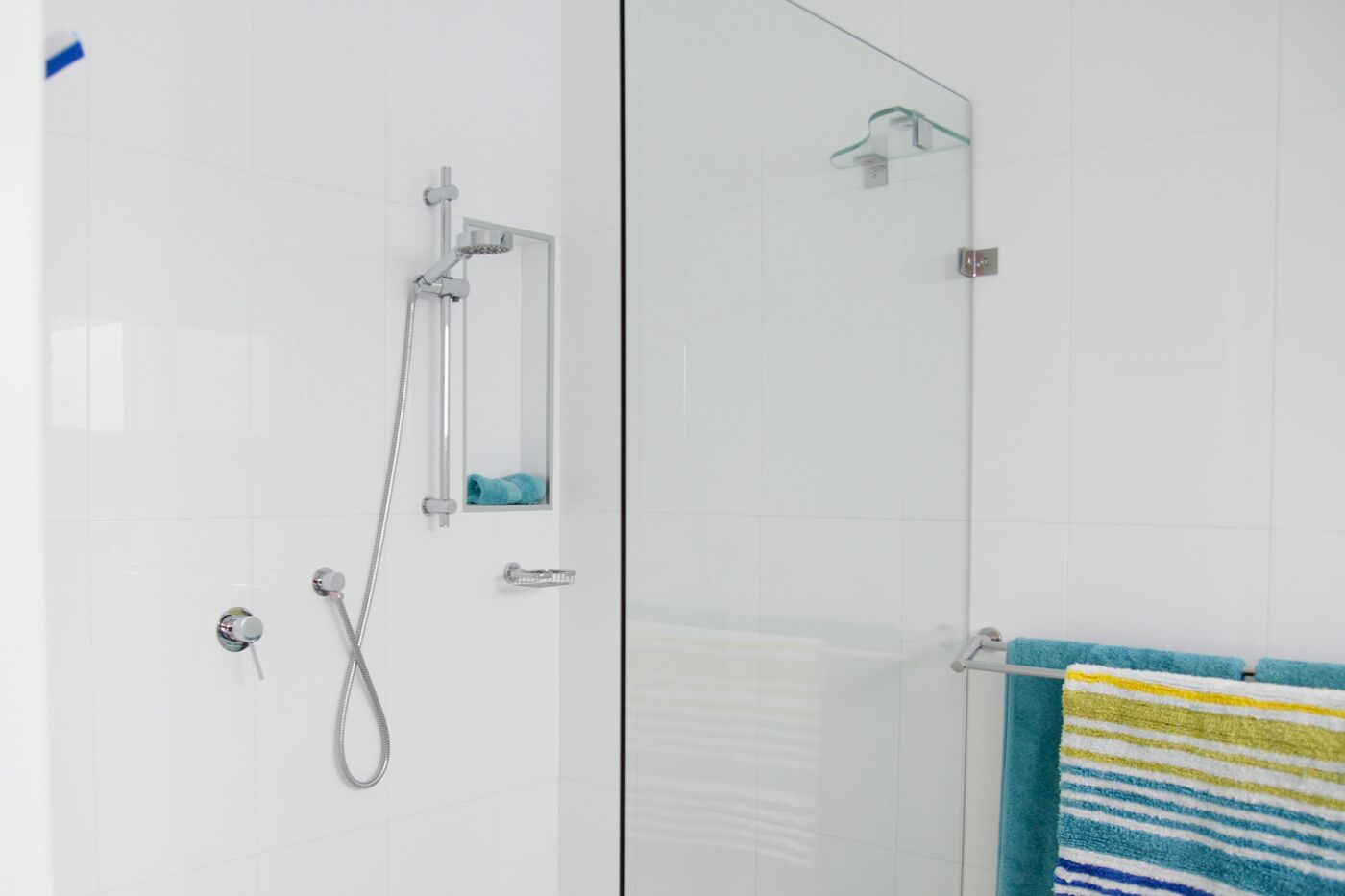 Shower, hair dryer, towels, toilet paper