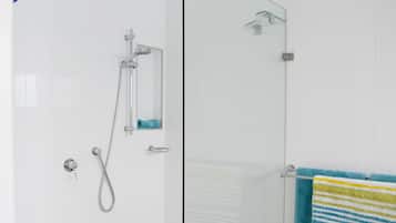 Shower, hair dryer, towels, toilet paper