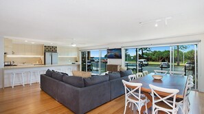 Enjoy a spacious open-plan living area with a large living space and separate dining area.