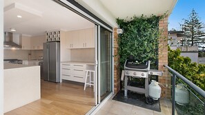 Enjoy cooking and dining with a gas stove and grill on the adjacent balcony.