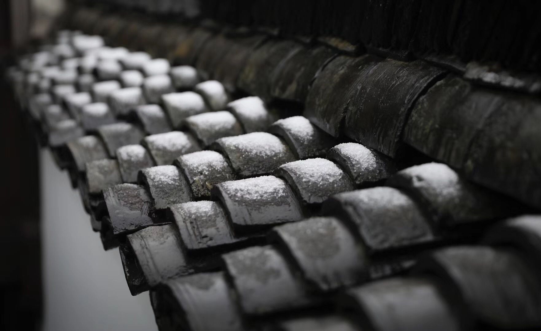 A close-up of a metal railing with a textured surface.