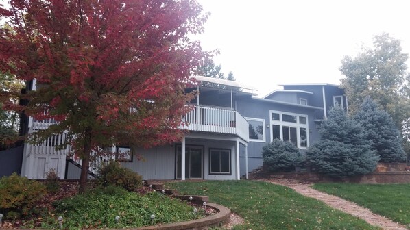 View of the deck and house from the backyard, gorgeous in every season!