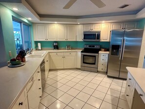 Fridge, microwave, oven, stovetop - Waterfront home with south facing pool & views over the bay (Marco Island)