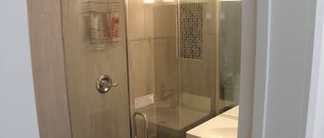 Combined shower/bathtub, towels, soap, toilet paper