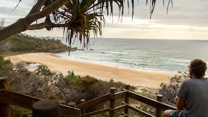 A wooden staircase leading to a beach with a view of the ocean. - Whale season is upon us, watch from your balcony (SUNSHINE BEACH)