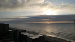A coastal cityscape with a view of the ocean and a sunset. - Panoramic Views from spacious 3 BR 2 BA condo (Myrtle Beach)