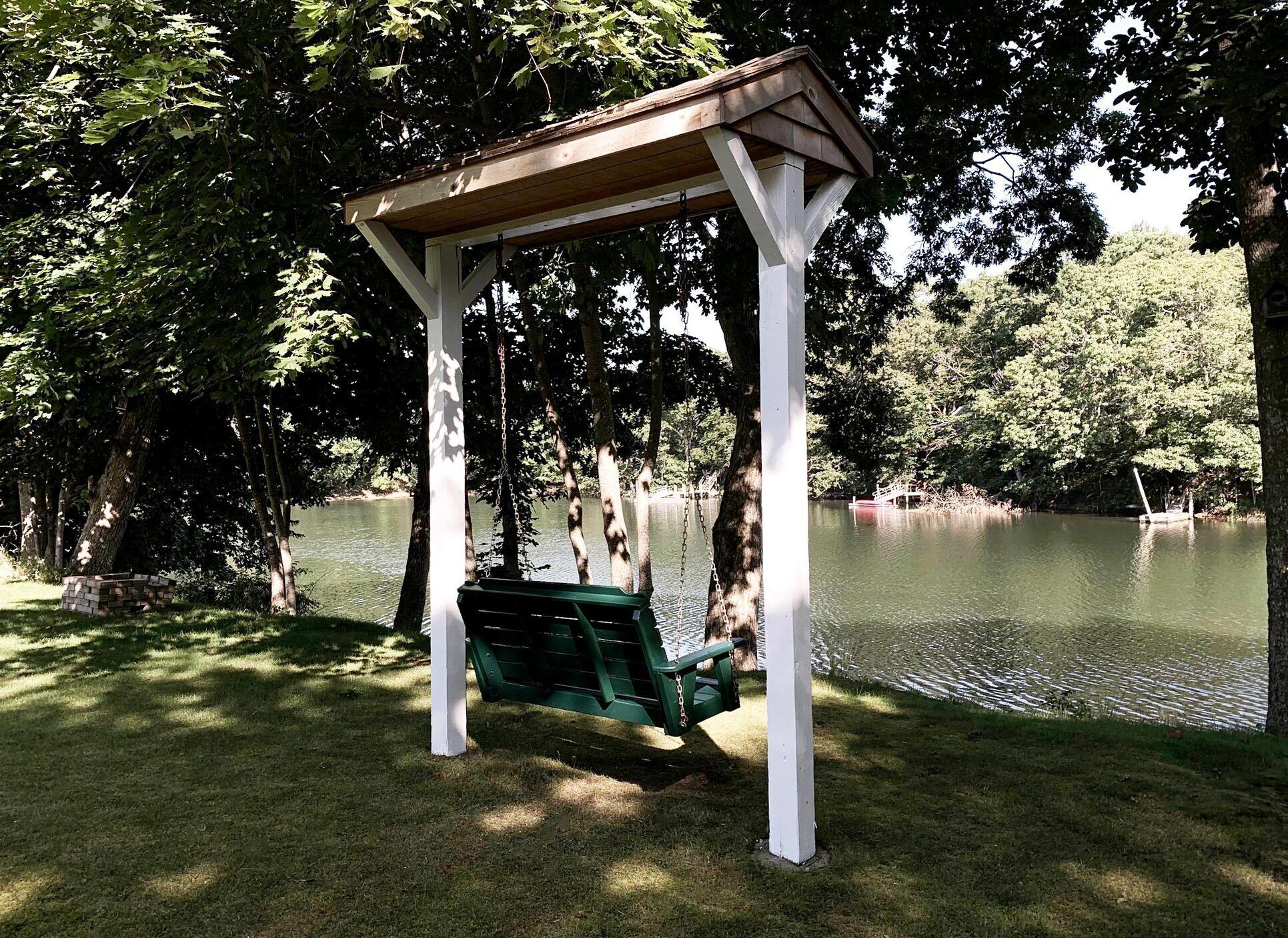 Relax in the swing with a glass of wine while watching the swans and geese