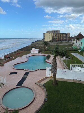 Outdoor pool, a heated pool - Spacious 3 Bedrm/2 Bth OceanFront Apt w/Large Balcony Overlooking Pool. Sleeps 9 (Daytona Beach Shores)