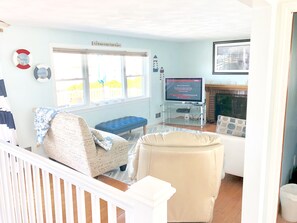 Smart TV, fireplace, DVD player, books