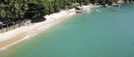 On the beach, sun-loungers