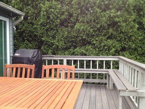 Enjoy al fresco dining on the deck with a barbecue grill and stunning views of the lush surroundings.