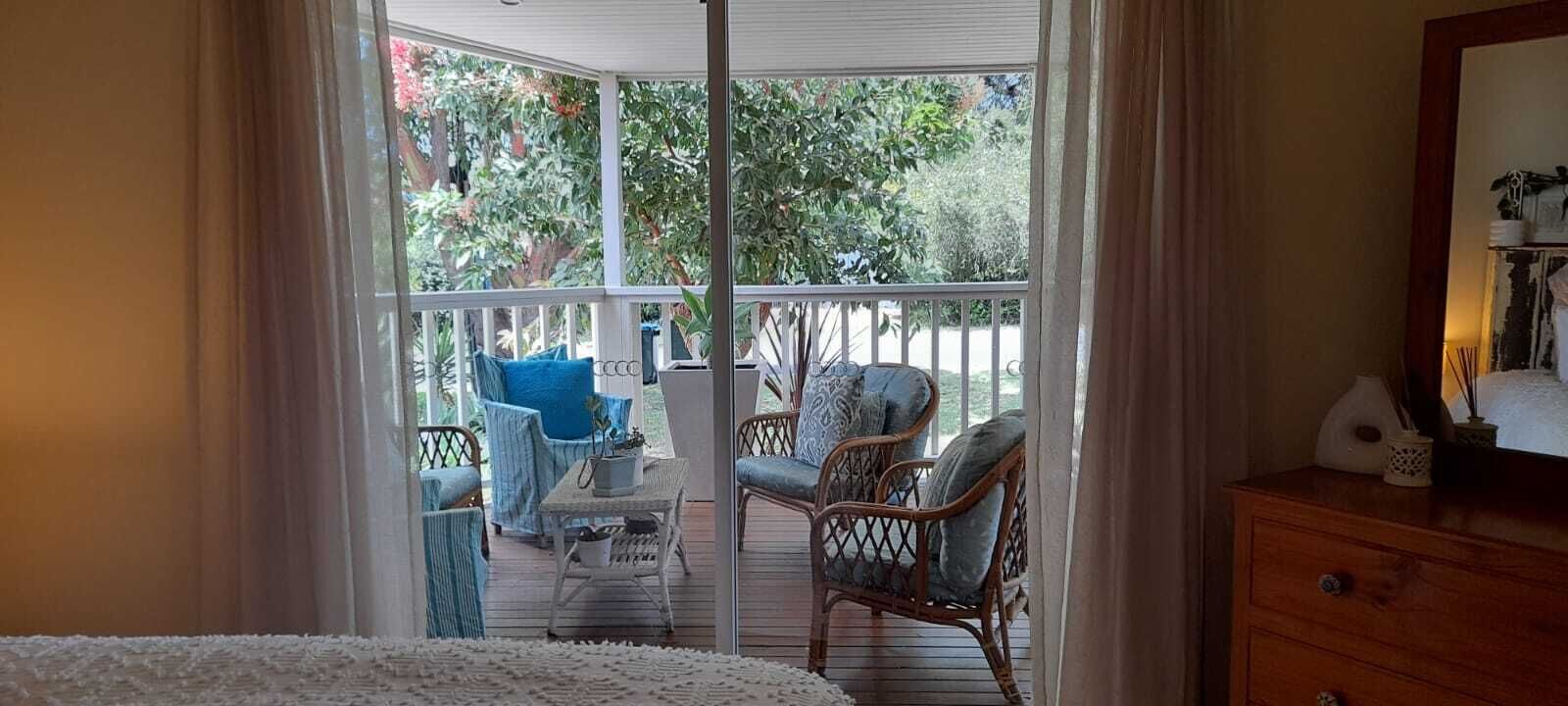 Main bedroom overlooking front deck and garden