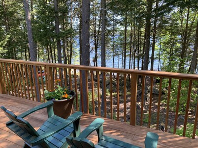 Log home on untouched cold stream lake 