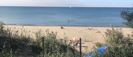 On the beach, sun-loungers, beach towels