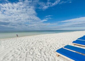 On the beach, sun-loungers