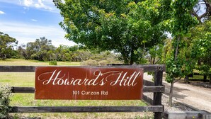 A sign for Howard's Hill at 101 Curzon Rd. - Howards Hill bed & breakfast (cape schanck)