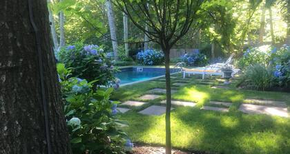 5.5 miles to U.S. Open! Swim in a sea of hydrangeas on this bucolic property.