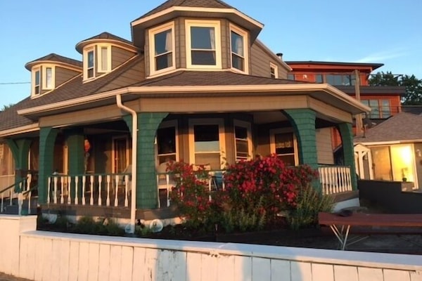 House facing lake. Full veranda. Ample seating. Screen porch. Upstairs master BR