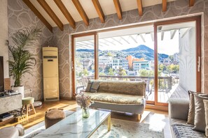 Family Townhome - Foreigner Only, 4 Bedrooms, Balcony, Garden Area(Fabulous Sunlit Heritage Mansion) | Living room | 60-inch flat-screen TV with cable channels, TV, computer - BS Tailored Serviced Home Near Gyeongbokgung (Seoul)