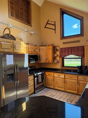 Fridge, microwave, oven, stovetop - Large Lakefront Home on Moosehead Lake with Spectacular Beach and Dock (Beaver Cove)