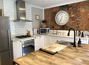 Fridge, microwave, oven, stovetop - The Edward Townhouse 151 | Tastefully Styled (Orange)