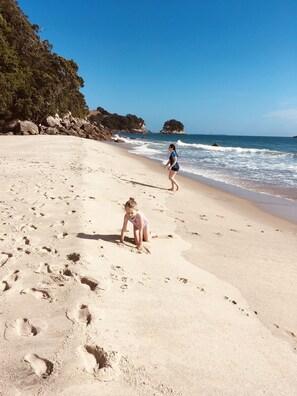 On the beach, sun loungers - Simply the best! Beach front, uninterrupted great views from all rooms (Whiritoa)