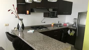 Fridge, microwave, stovetop, coffee/tea maker