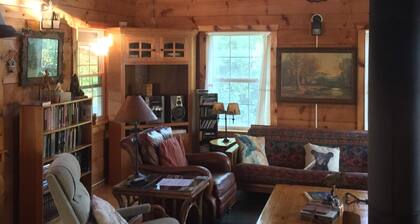 Secluded family-friendly log cabin with swimming pond. Charm, comfort.