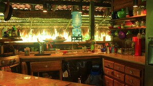 A kitchen with a large water dispenser, wooden cabinets, and a stove. - Book now!!  Free EGGS!! Also pool, 300m to beach and great gardens! (Playa Chiquita)