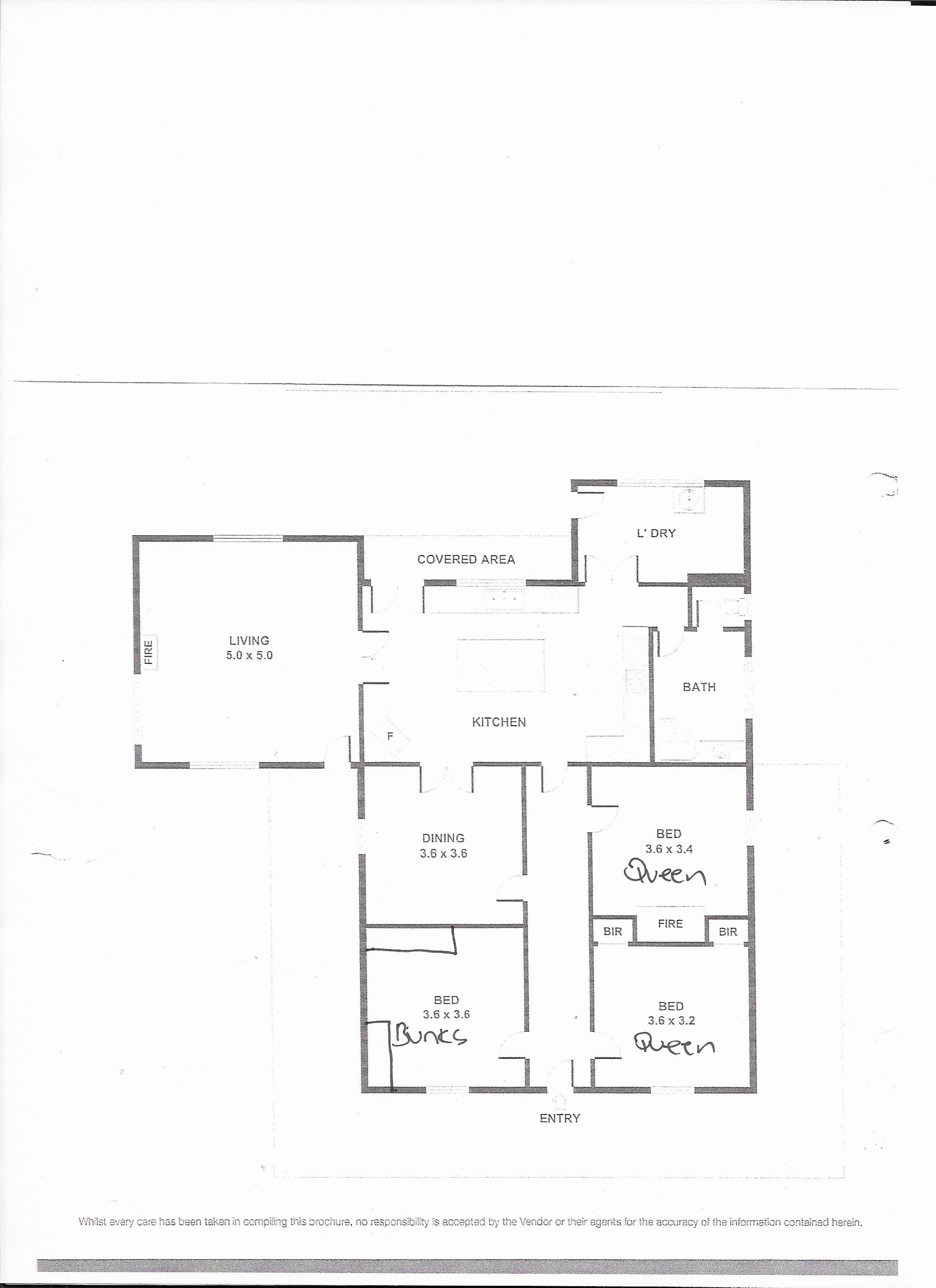 A floor plan of a house with a living room, kitchen, dining area, two bedrooms, a bathroom, and an entryway.