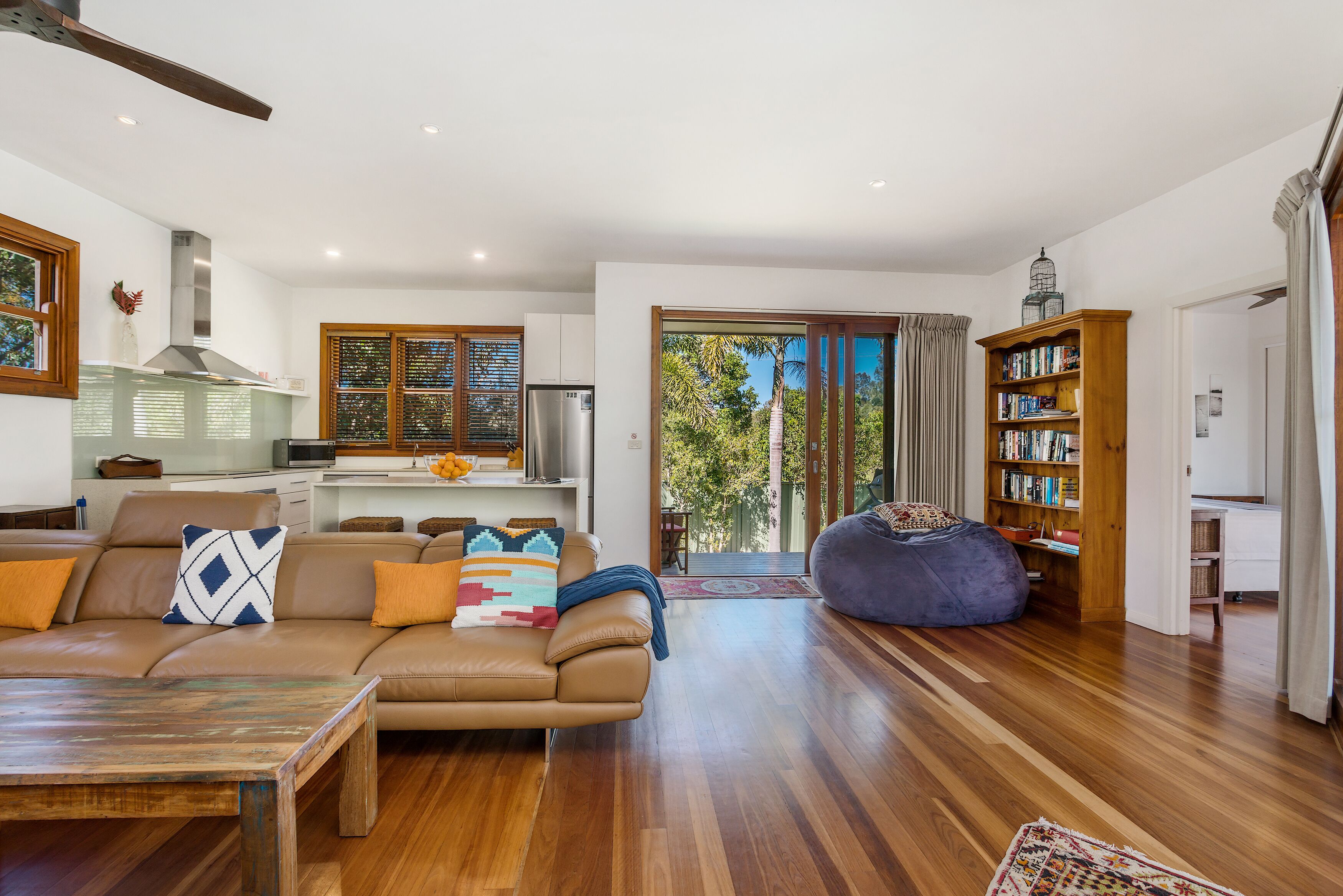 lounge room, back deckl and kitchen area