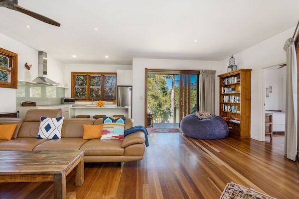 lounge room, back deckl and kitchen area