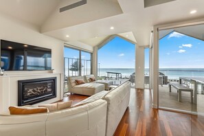 65-inch Smart TV with digital channels, fireplace