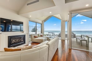 Premium House | Living area | 65-inch Smart TV with digital channels, fireplace