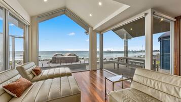 Premium House | Living area | 65-inch Smart TV with digital channels, fireplace