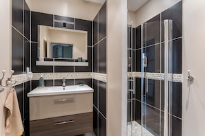 Shower, hair dryer, towels, soap