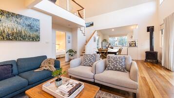 Wattamolla Lodge | Living area | LCD TV, fireplace, DVD player, MP3 dock