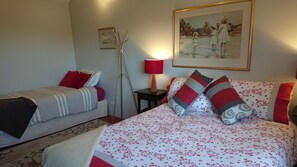 A hotel room with two beds, a nightstand with a lamp, a framed painting on the wall, and a floor lamp. - Lost in the Vines. Vineyard Escape. (Blewitt Springs)