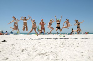 On the beach, sun-loungers