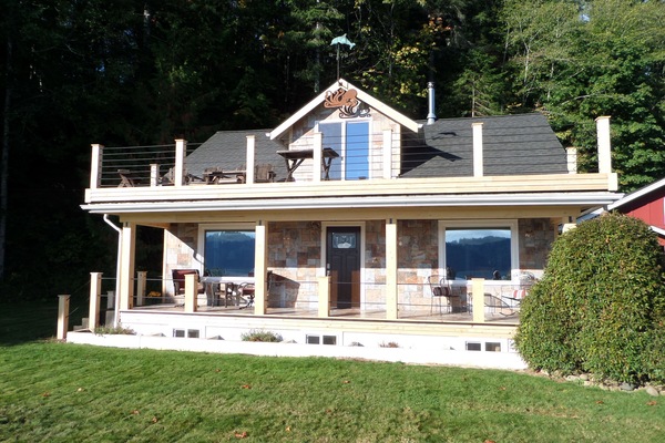 1920's farm house with upper and lower deck across from the Hood Canal