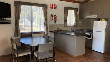 Riverfront Cabin | Private kitchen | Full-sized fridge, microwave, stovetop, electric kettle