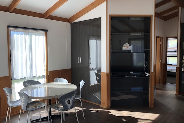 Three-Bedroom Riverfront Cabin | Private kitchen | Full-size fridge, microwave, stovetop, electric kettle