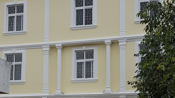 A multi-story building with symmetrical windows and white trim. - Spacious Beautifuly Furnished 3 Bedroom, Hall & Kitchen apartment. (Hyderabad)