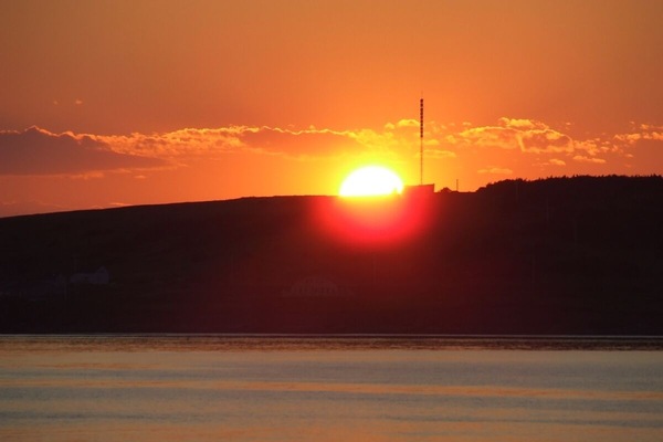 striking island sunset  through kitchen window.