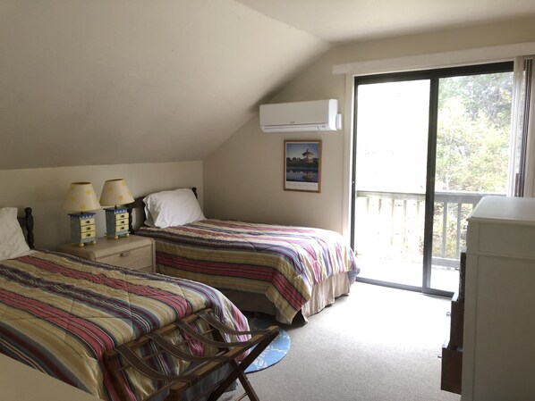A bedroom with two beds, a window, and a ceiling fan. - Katama Edgartown... bike to South Beach, bike to Town (Edgartown)